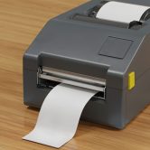 label-printer-wooden-surface